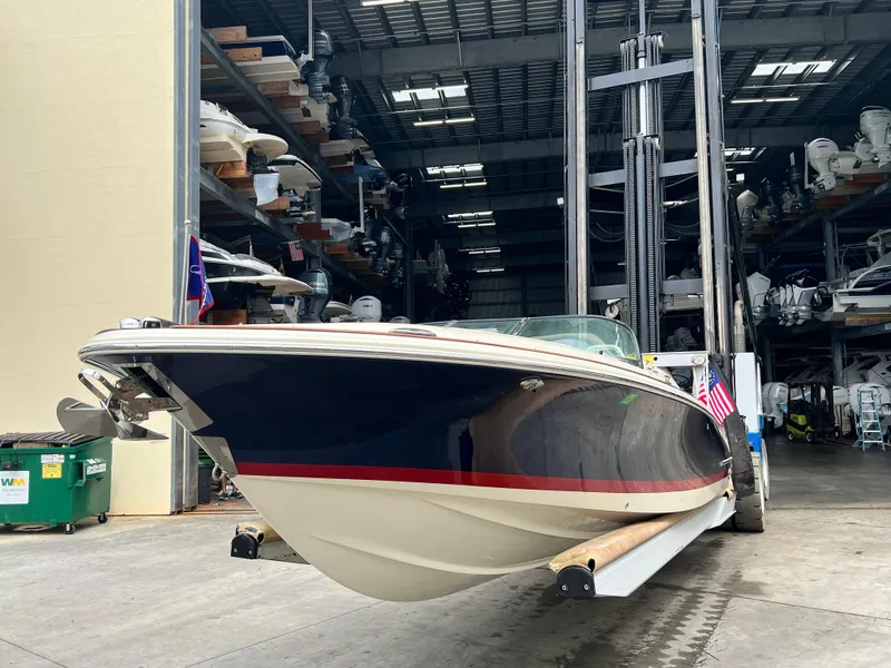 Slide: The Image of 2022 Chris-Craft Launch 27 boat in storage facility. - 2