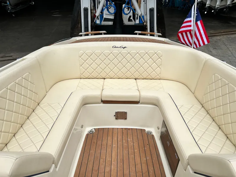 Slide: The Image of 2022 Chris-Craft Launch 27 boat with luxurious cream leather seating and wooden deck. - 20