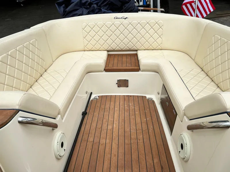 Slide: The Image of 2022 Chris-Craft Launch 27 boat with luxurious cream seating and teak flooring. - 22