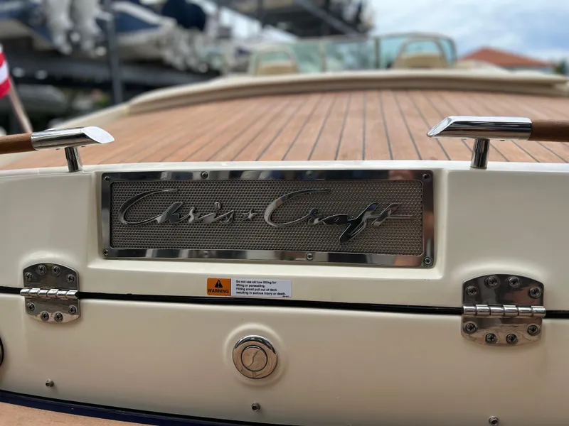 Slide: The Image of 2022 Chris-Craft Launch 27 boat with teak deck and chrome details. - 37