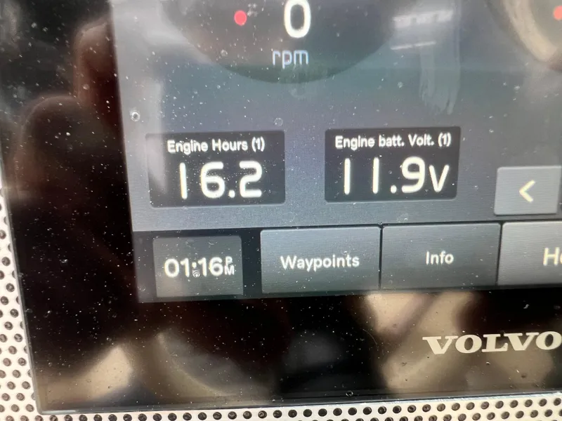 Slide: The Image of Close-up of 2022 Chris-Craft Launch 27 dashboard showing engine hours and battery voltage. - 38