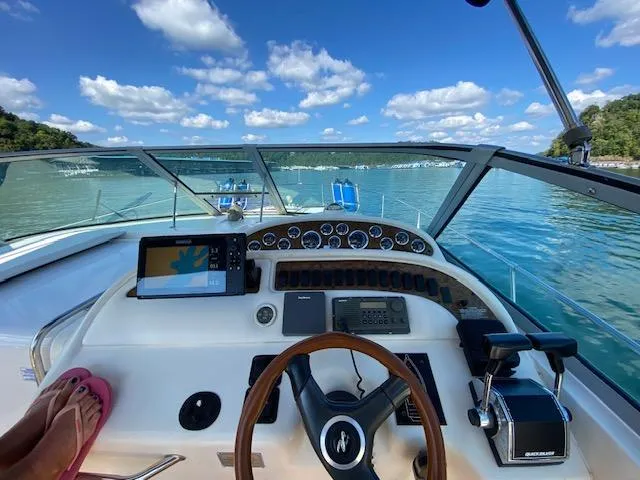 Slide: The Image of Cockpit view of a 2000 Sea Ray 310 Sundancer on a sunny day. - 2