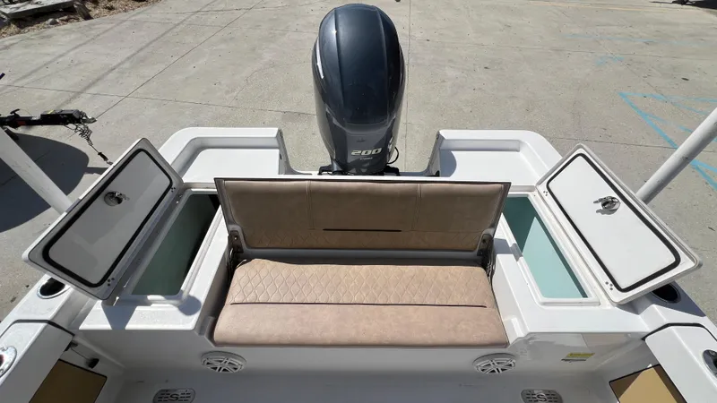 Slide: The Image of 2019 Sportsman 227 MASTERS Platinum boat with rear seating and storage compartments. - 10