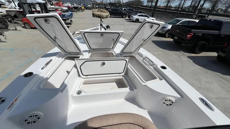 Slide: The Image of 2019 Sportsman 227 MASTERS Platinum boat with open storage compartments. - 15