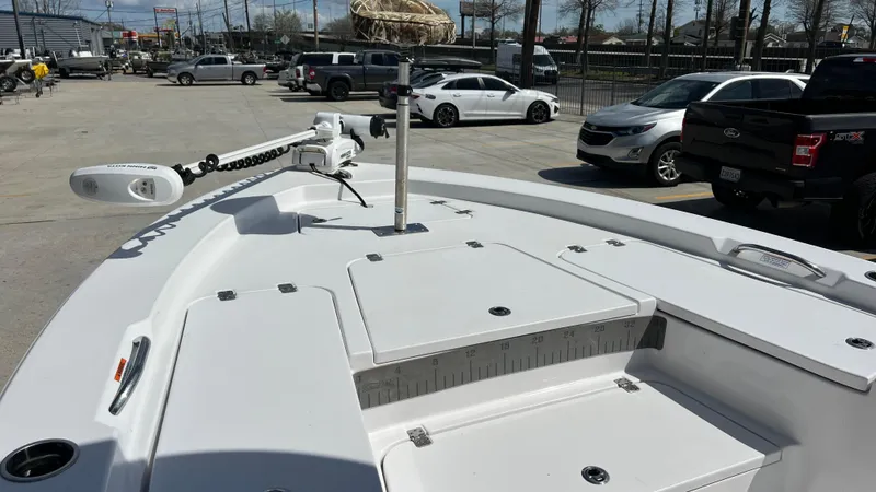 Slide: The Image of 2019 Sportsman 227 MASTERS Platinum boat, front deck view with storage compartments and trolling motor. - 17