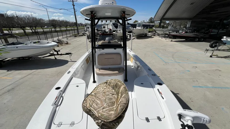 Slide: The Image of 2019 Sportsman 227 MASTERS Platinum boat on display at a marina. - 19