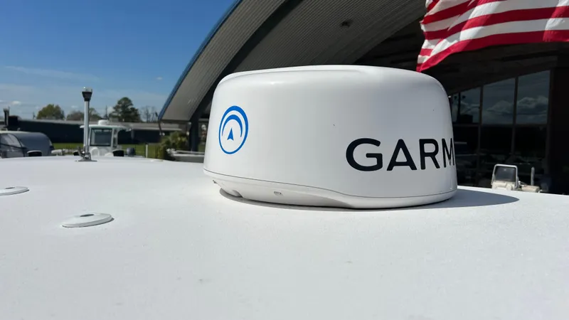 Slide: The Image of Garmin radar on 2019 Sportsman 227 MASTERS Platinum boat with American flag in background. - 21