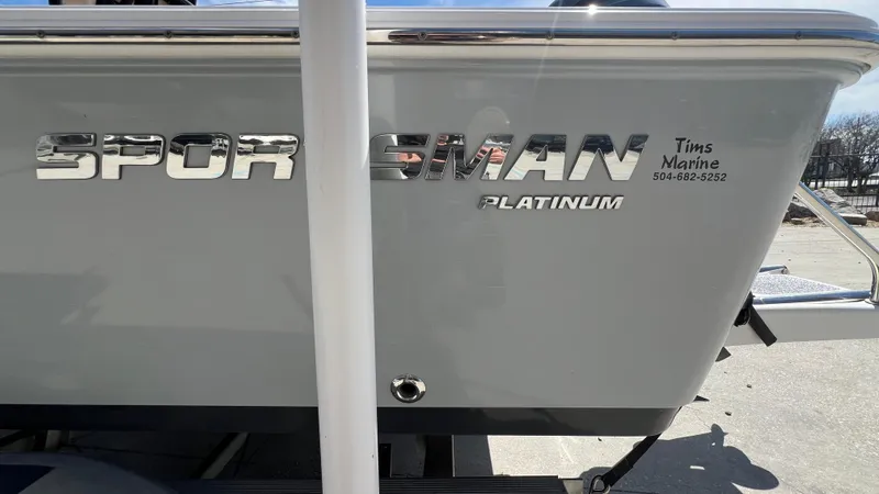 Slide: The Image of 2019 Sportsman 227 MASTERS Platinum boat side view with logo and dealer contact. - 23
