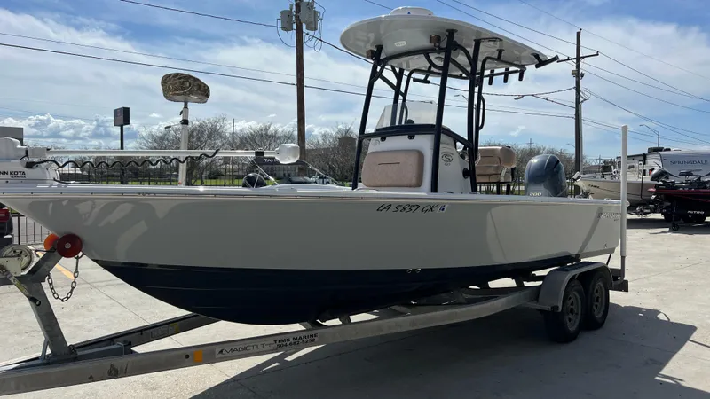 Slide: The Image of 2019 Sportsman 227 MASTERS Platinum boat on a trailer in a marina. - 5