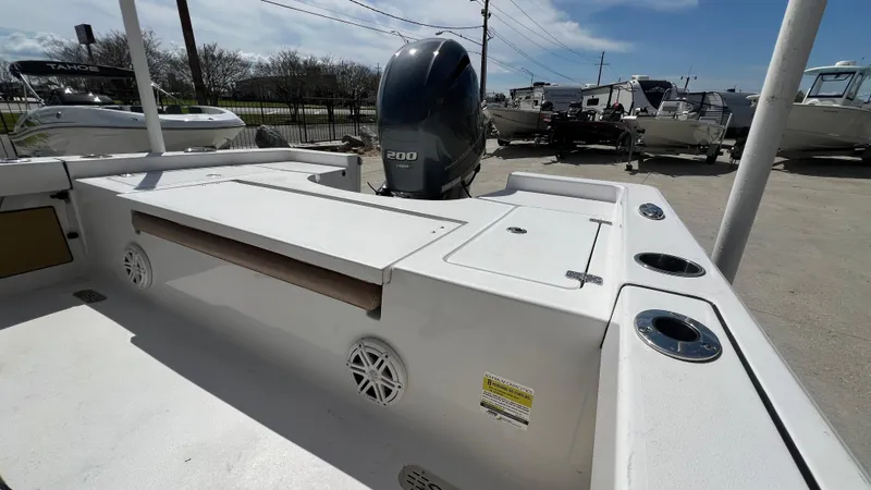 Slide: The Image of 2019 Sportsman 227 MASTERS Platinum boat, rear deck view with motor and storage compartments. - 9