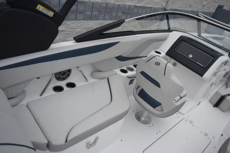 Slide: The Image of 2024 Hurricane SunDeck 2600 OB boat interior with white and blue seating. - 10