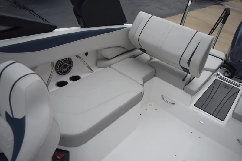 Slide: The Image of 2024 Hurricane SunDeck 2600 OB boat interior with white and blue seating. - 12