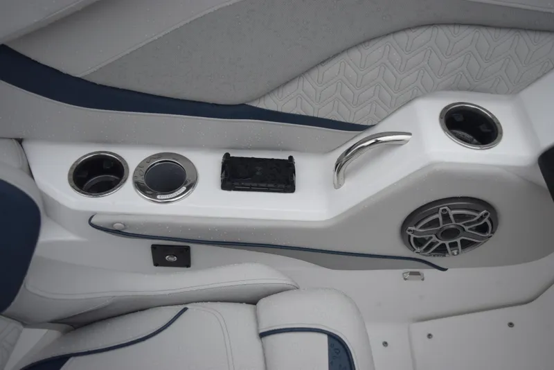 Slide: The Image of Interior detail of 2024 Hurricane SunDeck 2600 OB boat with cup holders and speaker. - 16