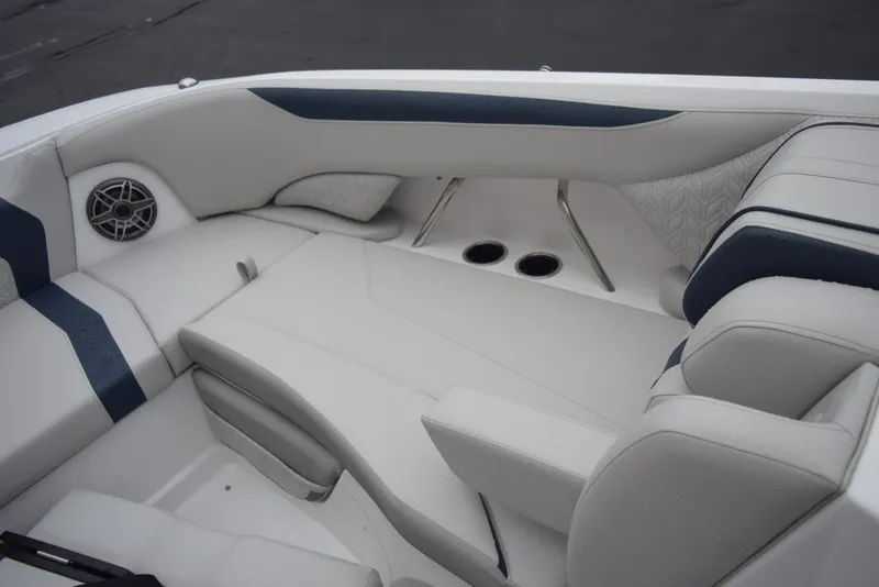 Slide: The Image of 2024 Hurricane SunDeck 2600 OB boat interior with white and blue seating. - 17