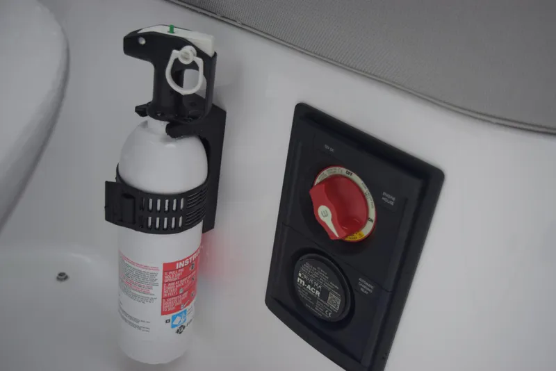 Slide: The Image of Fire extinguisher and control panel on 2024 Hurricane SunDeck 2600 OB boat. - 20