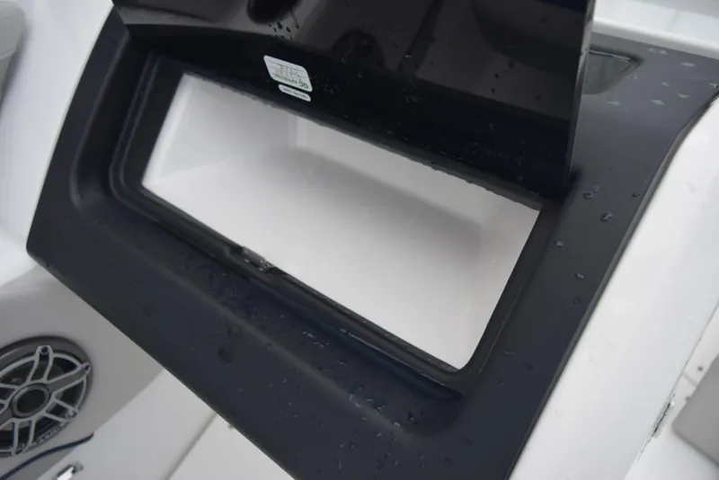 Slide: The Image of Close-up of storage compartment on 2024 Hurricane SunDeck 2600 OB boat. - 24
