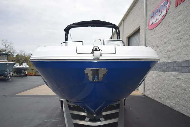 Slide: The Image of 2024 Hurricane SunDeck 2600 OB boat front view in dealership lot. - 3