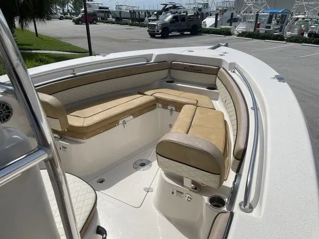 Slide: The Image of 2023 Sea Chaser 22 HFC boat with tan seating and center console. - 11