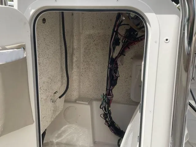 Slide: The Image of 2023 Sea Chaser 22 HFC boat seating with beige and white upholstery. - 16