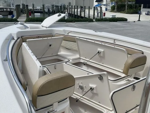 Slide: The Image of 2023 Sea Chaser 22 HFC livewell with clear lid and logo. - 19