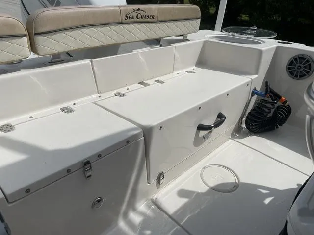 Slide: The Image of 2023 Sea Chaser 22 HFC boat console with steering wheel and control panel. - 23