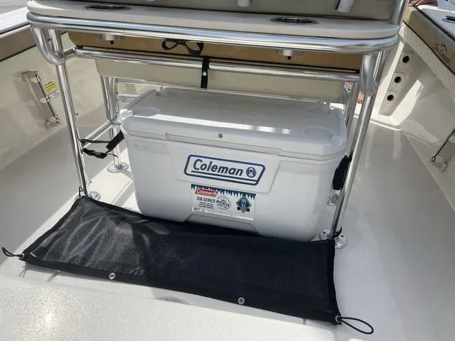 Slide: The Image of 2023 Sea Chaser 22 HFC boat T-top with rod holders and storage compartment. - 25