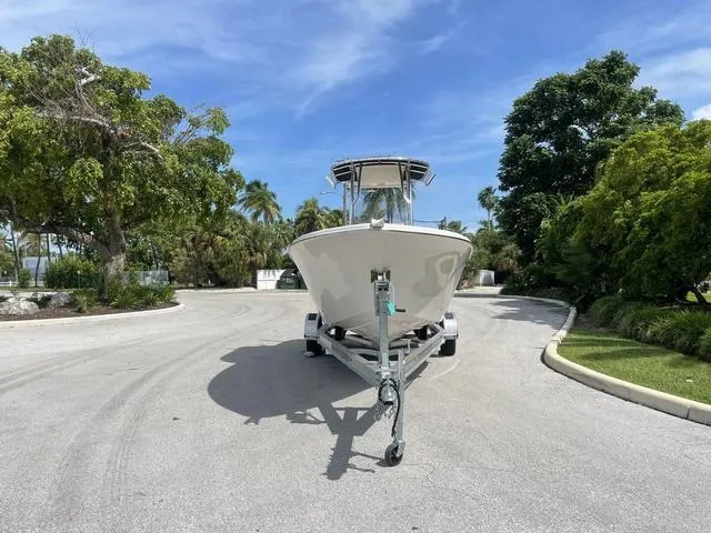 Slide: The Image of 2023 Sea Chaser 22 HFC boat on a trailer in a tropical setting. - 6