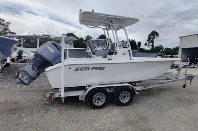 Slide: The Image of 2024 Sea Pro 202 CC boat on trailer with Yamaha outboard motor. - 13