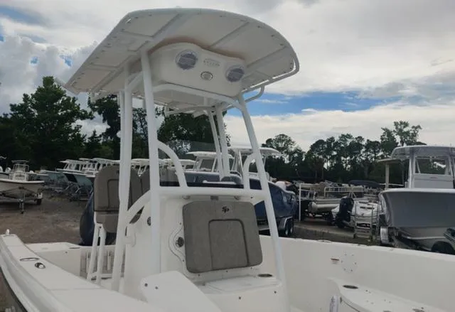 Slide: The Image of 2024 Sea Pro 202 CC center console boat with T-top in a marina. - 15