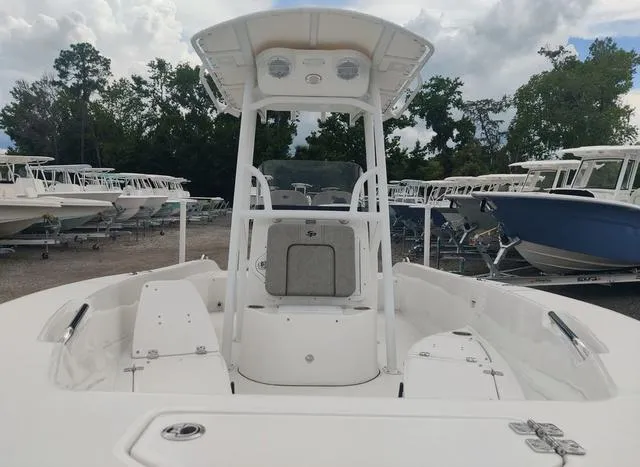 Slide: The Image of 2024 Sea Pro 202 CC center console boat in a marina. - 4