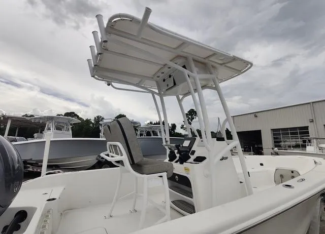 Slide: The Image of 2024 Sea Pro 202 CC center console boat with T-top and captain's chair. - 6
