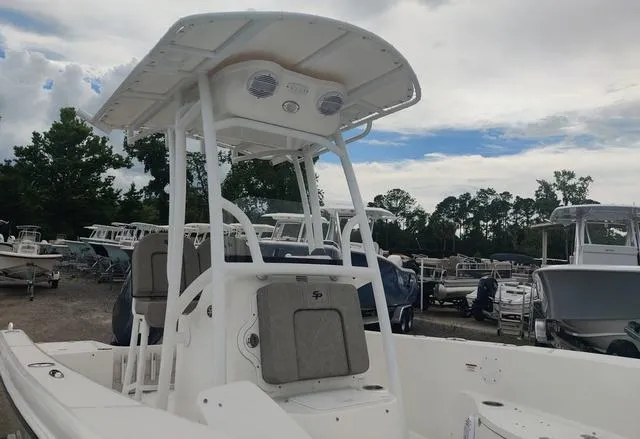 Slide: The Image of 2024 Sea Pro 202 CC center console boat with T-top in a marina. - 7