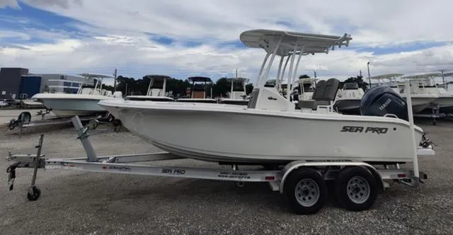 Slide: The Image of 2024 Sea Pro 202 CC boat on a trailer in a marina. - 9