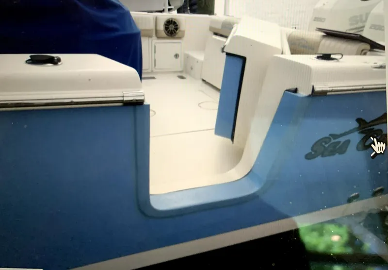 Slide: The Image of 2019 Sea Chaser 27 HFC boat interior with blue and white seating. - 12