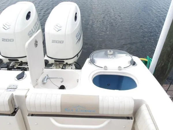 Slide: The Image of 2019 Sea Chaser 27 HFC boat with dual Suzuki 200 engines and fishing amenities. - 14
