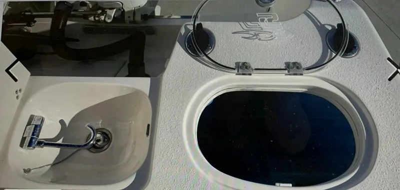 Slide: The Image of 2019 Sea Chaser 27 HFC boat sink and livewell on deck. - 16