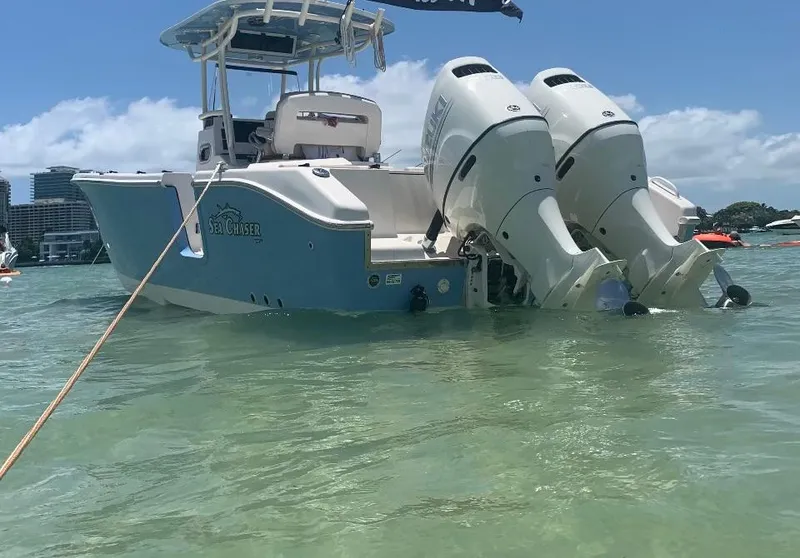 Slide: The Image of 2019 Sea Chaser 27 HFC boat with dual engines in clear water, sunny day. - 4