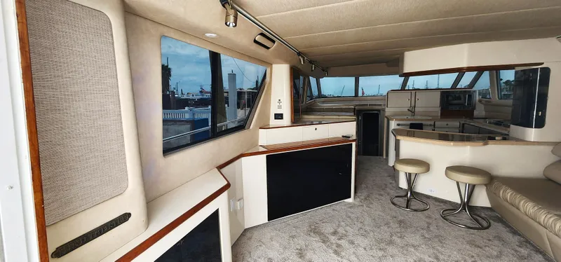 Slide: The Image of Interior of a 1997 Sea Ray 550 Sedan Bridge yacht with modern furnishings. - 13