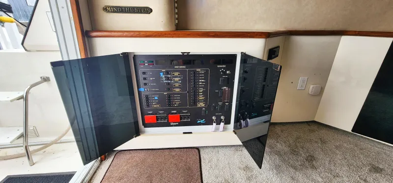 Slide: The Image of Electrical control panel on a 1997 Sea Ray 550 Sedan Bridge yacht. - 14