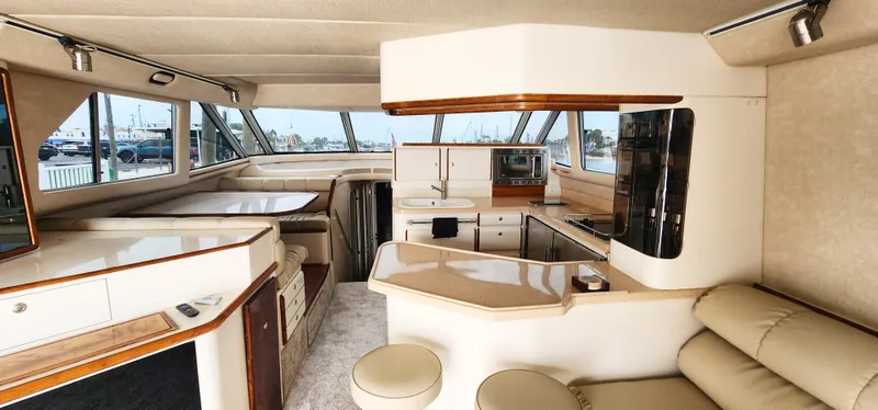 Slide: The Image of Interior of a 1997 Sea Ray 550 Sedan Bridge yacht with modern amenities. - 15