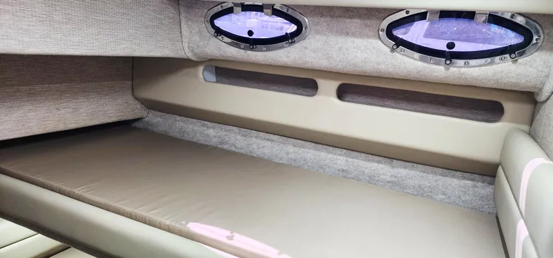 Slide: The Image of Interior cabin of a 1997 Sea Ray 550 Sedan Bridge yacht with porthole windows. - 22