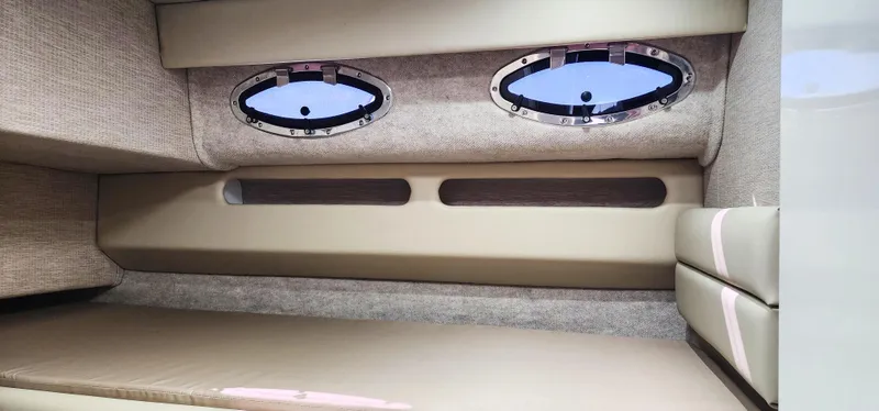 Slide: The Image of Interior cabin of a 1997 Sea Ray 550 Sedan Bridge with porthole windows. - 23