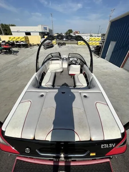 Slide: The Image of 2006 Malibu 23 LSV boat with spacious seating and modern design. - 7