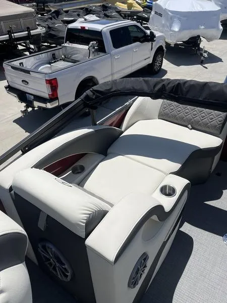 Slide: The Image of 2023 Veranda VP22RFL pontoon boat with luxurious seating and cup holders. - 12