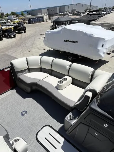 Slide: The Image of 2023 Veranda VP22RFL pontoon boat with spacious seating and cup holders. - 8