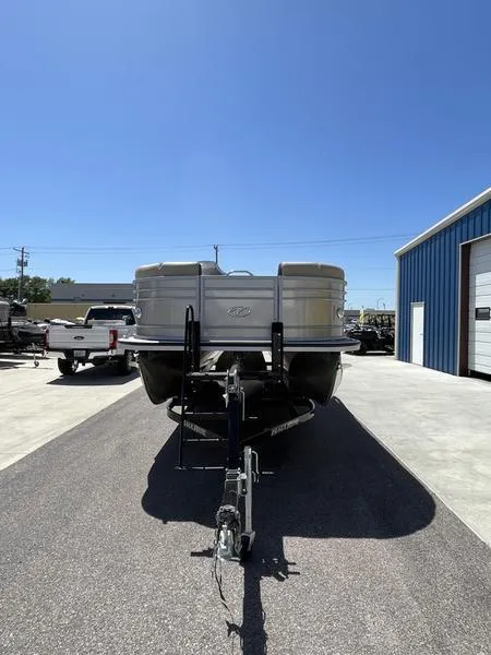 Slide: The Image of 2023 Veranda VP22VLB pontoon boat on trailer in a parking lot. - 6