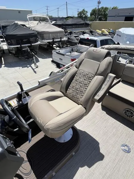 Slide: The Image of 2023 Veranda VP22VLB boat captain's chair in a marina. - 7