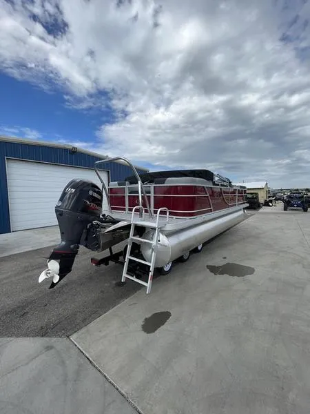 Slide: The Image of 2023 Veranda VR22RC pontoon boat with outboard motor in a marina. - 4