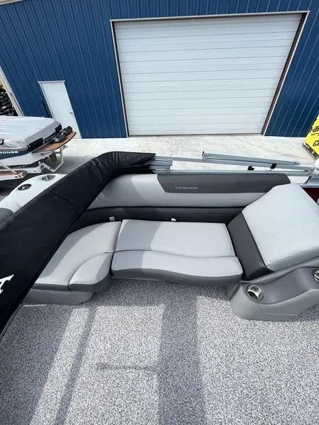 Slide: The Image of 2023 Veranda VR22RC pontoon boat with gray seating and blue exterior. - 9
