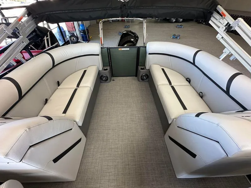 Slide: The Image of 2024 Crest Classic LX 220 SLC CPT pontoon boat interior with spacious seating and modern design. - 10